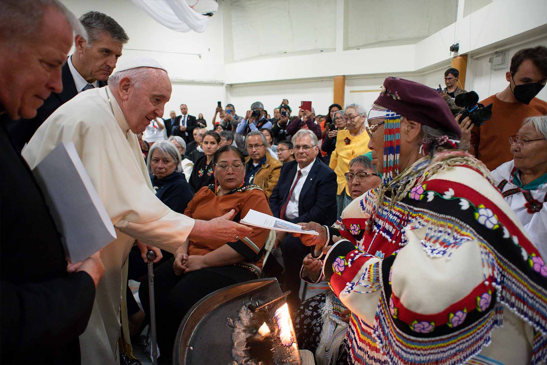 A photo of Pope Francis receiving the testimony of an Inuit Elder inside Nakasuk Elementary School in Iqaluit, Nunavut.