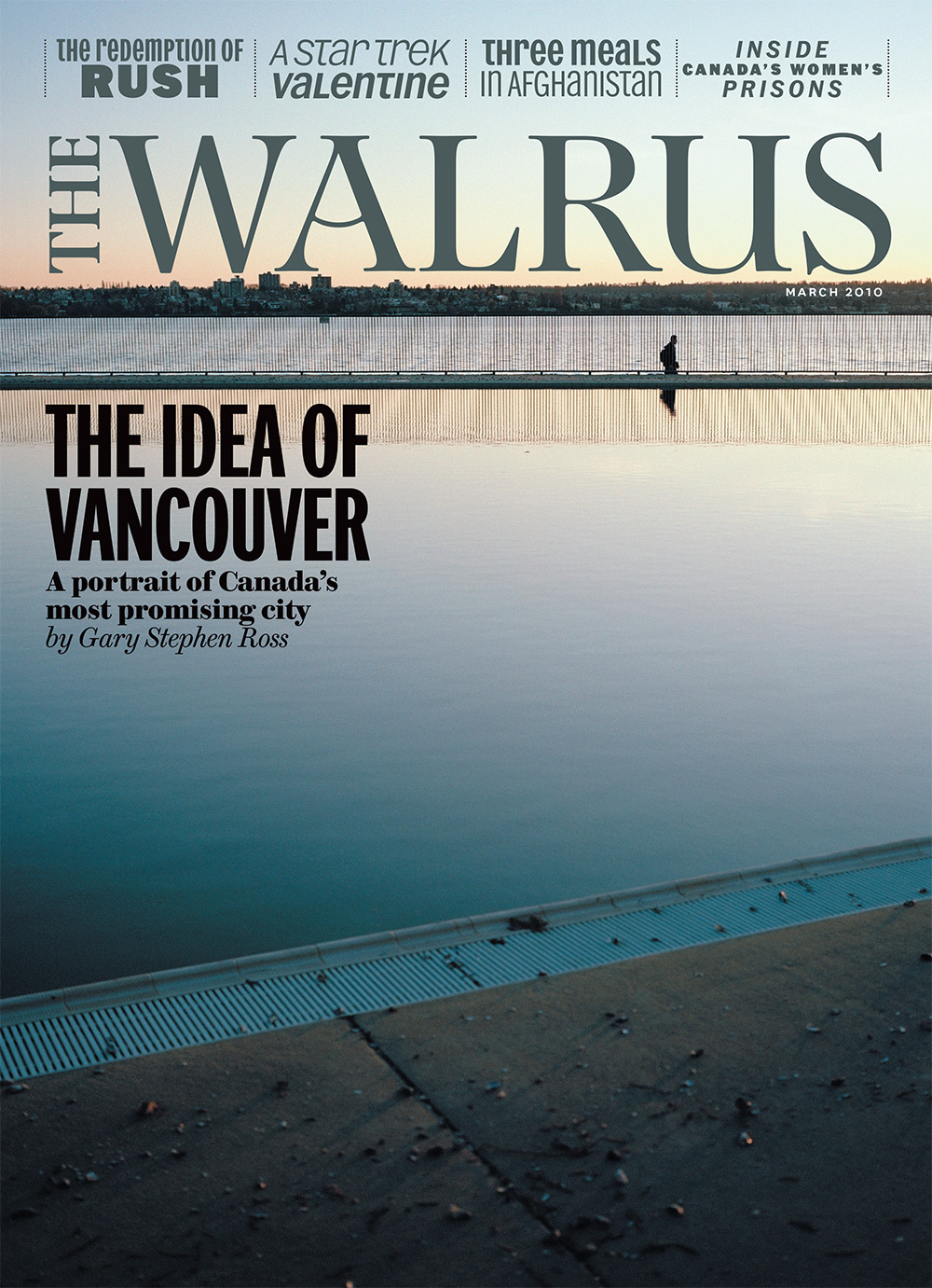 Cover of The Walrus magazine featuring a photo of a figure walking next to a large body of water. The Walrus wordmark is in blue at the top and the main headline reads 'The Idea of Vancouver.'