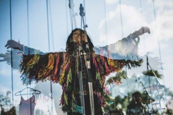 A 2015 double-exposure photo of Buffy Sainte-Marie performing at the Interstellar Rodeo in Edmonton, AB.