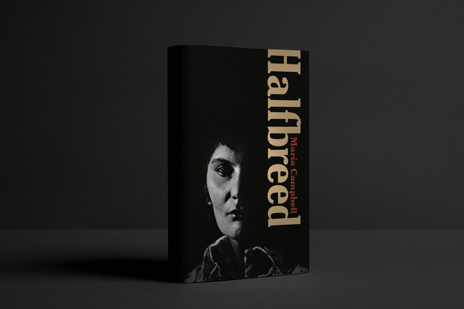 A photo illustration of a book mock-up with the cover of “Halfbreed” by Maria Campbell.