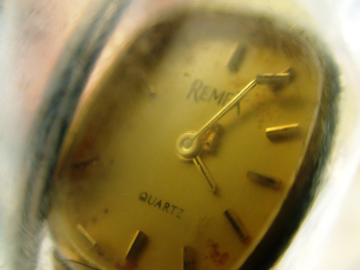 A close-up photo of a stopped watch, one of the personal effects of the passengers.