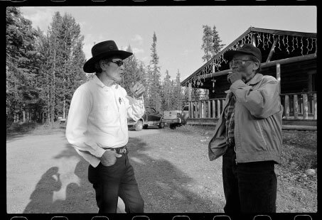 Pat Edzerza, at left, chats with Bobby Quock in the front yard of Edzerza’s Dease Lake home.