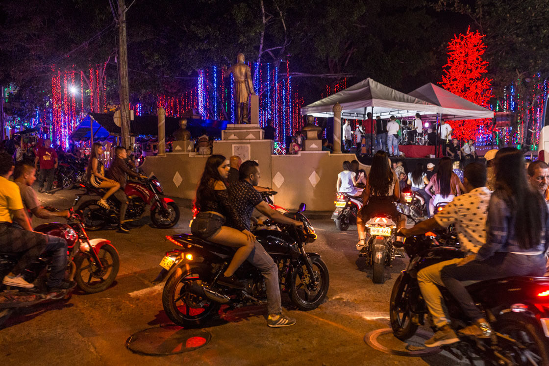 Young people on motorbikes cruise the streets on a Friday night.