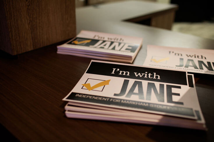 A stack of flyers that read I'm with Jane