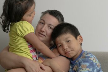 Photo of Amandine Galiussi with her two children.