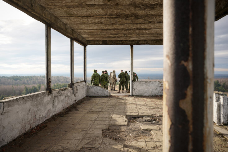 Canadian and Ukrainian soldiers survey a training area during an Operation Unifier exercise in December 2018.