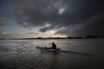 Tahi Nepia, a waka ama (outrigger canoe) paddler and caretaker at a Maori immersion school, travels on the Whanganui River in New Zealand on June 14, 2022. Before venturing out, he makes sure to first ask permission from his ancestors in a prayer, or karakia. It's the top item on his safety list. He says his ancestors inhabit the river and each time he dips his paddle into the water, he touches them. You are giving them a mihimihi, you are giving them a massage," Nepia says. "Thats how we see that river. Its a part of us. (AP Photo/Brett Phibbs)
