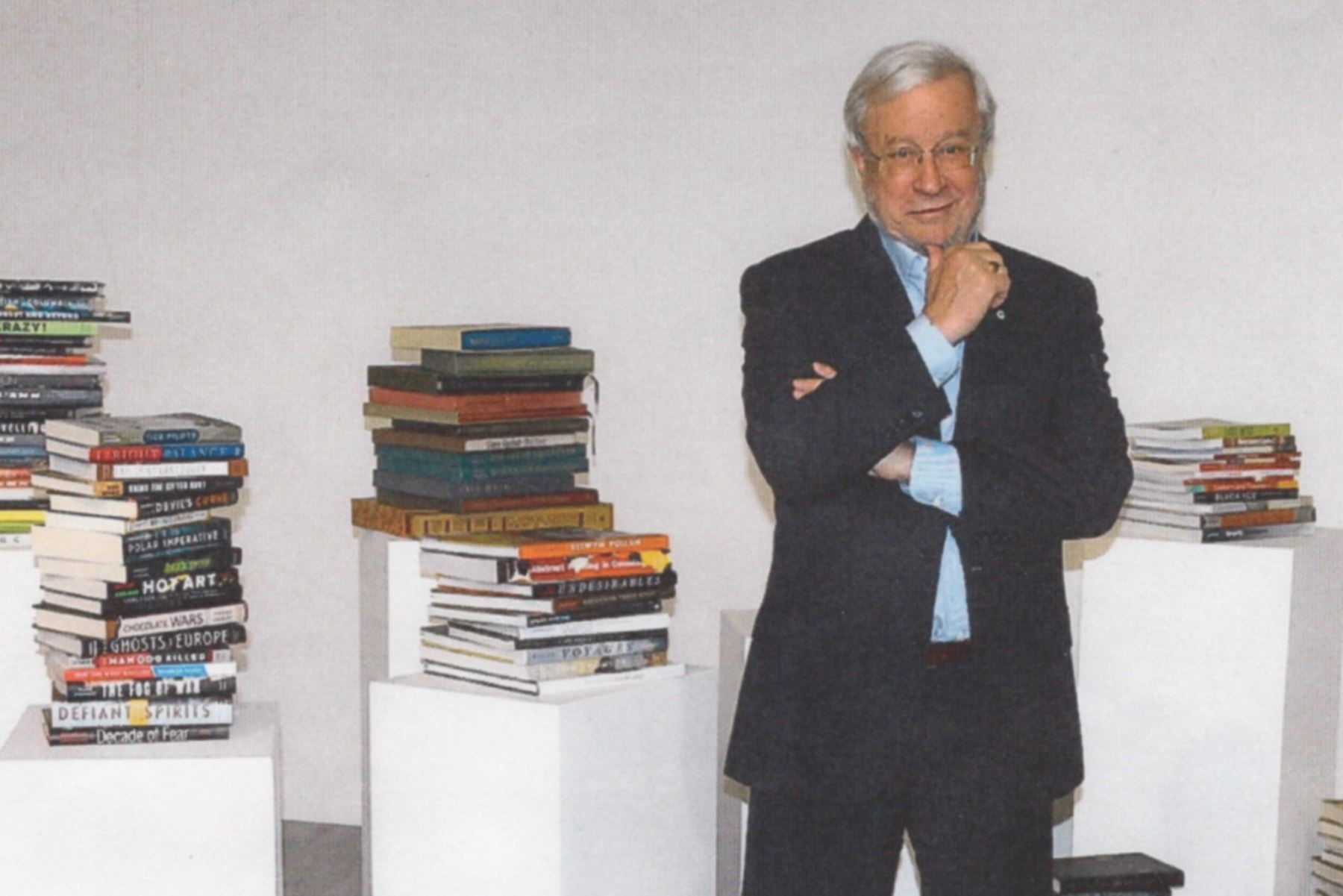 Photo of Douglas &
McIntyre co-founder Scott McIntyre standing in front of stacks of books.