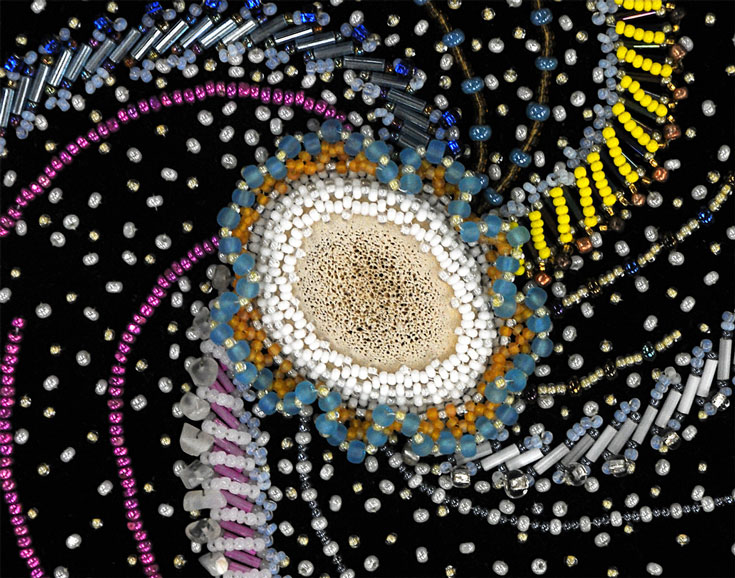 A close-up of the center of the beadwork depicting the Milky Way.