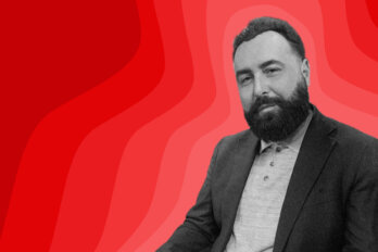 Black and white photo of poet Michael Lista on a red background.