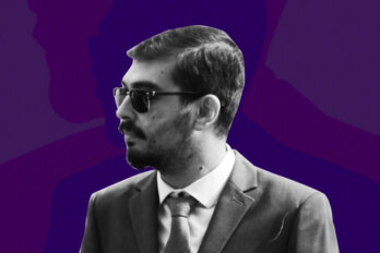 Poet Bardia Sinaee pictured in a suit and sunglasses