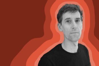A black-and-white photo of the poet Nicholas Bradley against an orange background