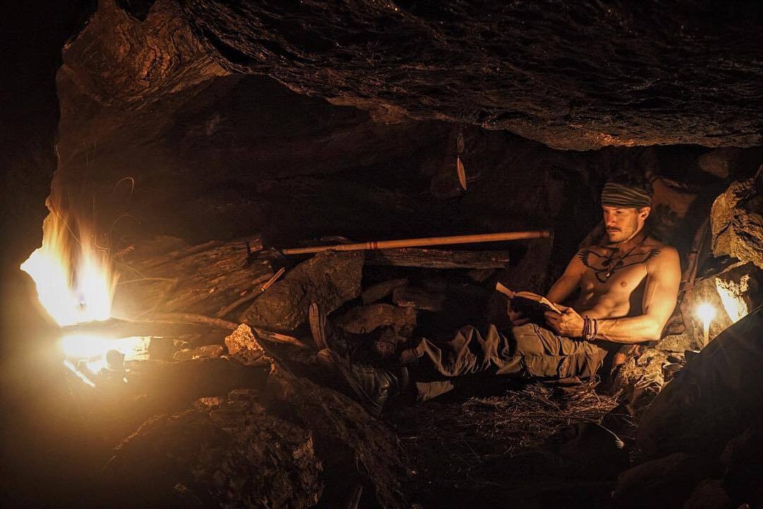 A photograph of Justin in a cave