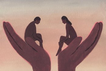 A man and a woman sit in two large open palms, facing one another.