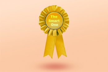 A gold award ribbon that says "The Smart One," floating against a pale pink background.