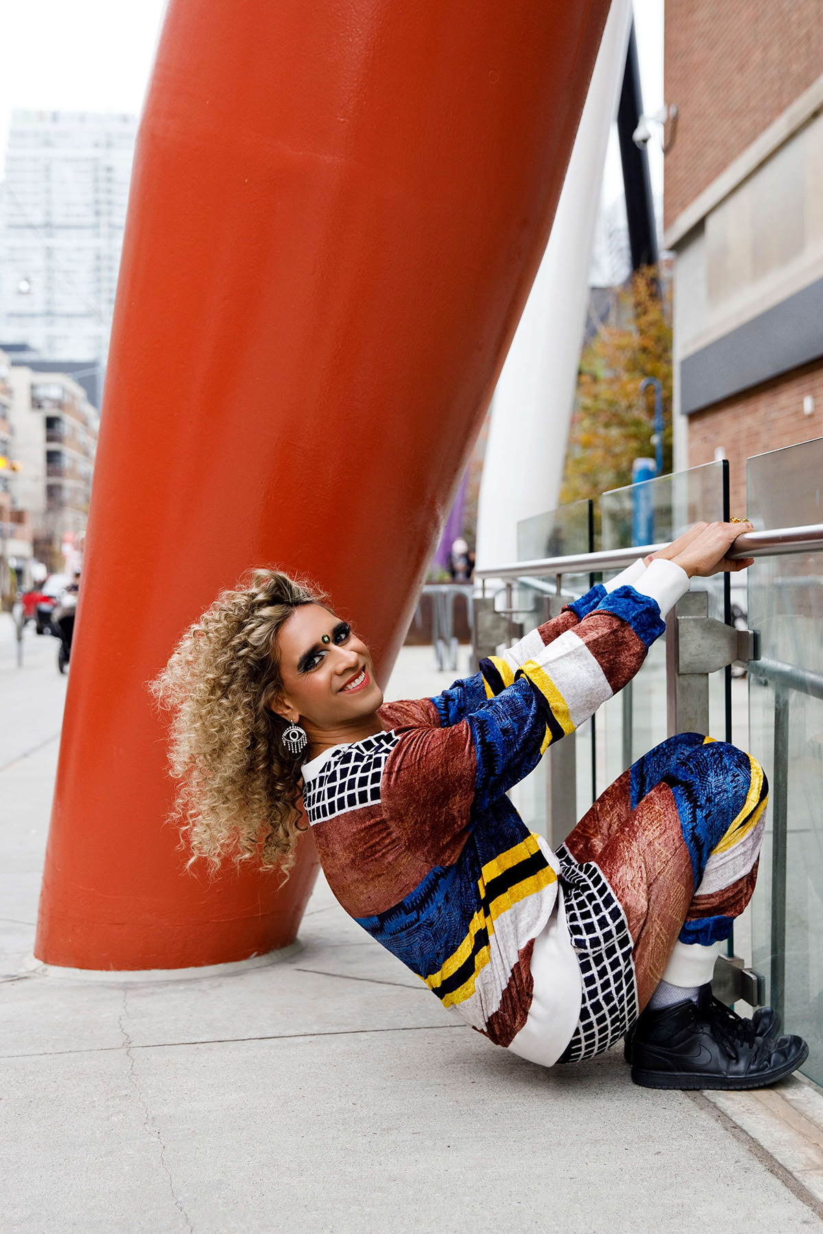 Vivek Shraya hanging off 