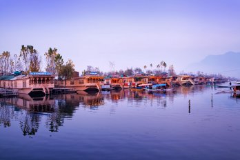 floating houses on a lake in kashmir