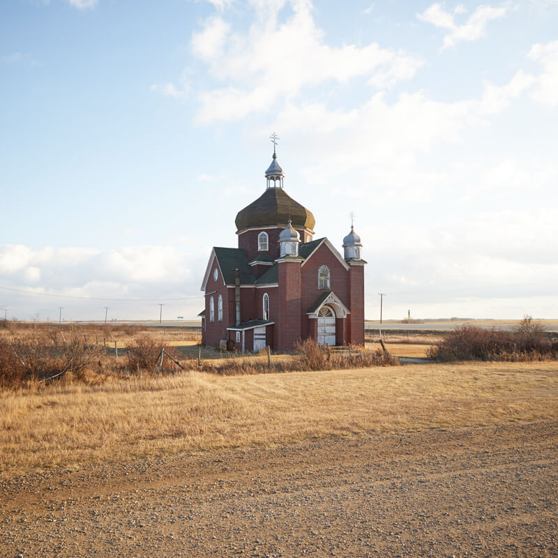 Brick church in field