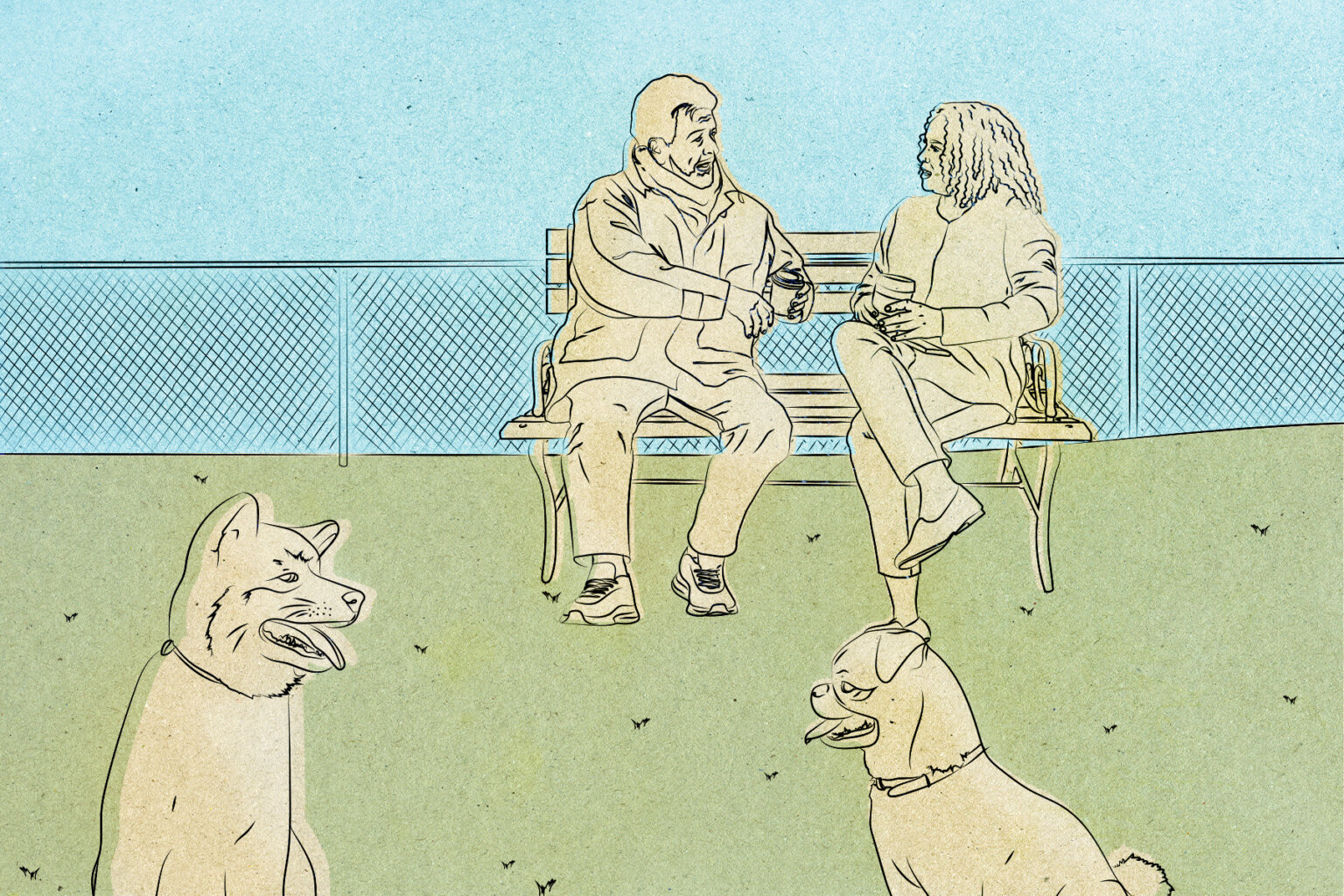 Two people chatting in a dog park.