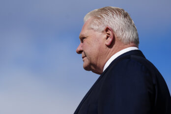 A side profile of Ontario premier Doug Ford against a blue sky
