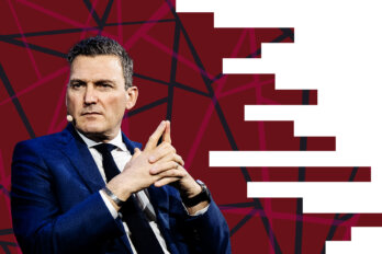 Photo of Evan Solomon against a red background.