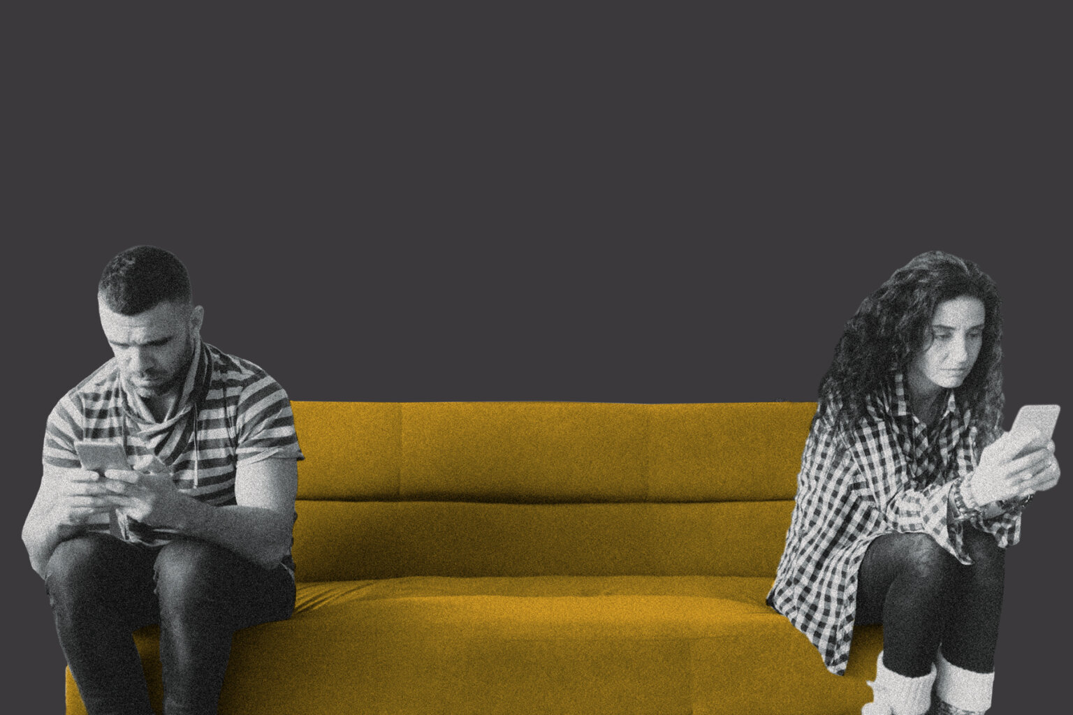 A couple sits separately on a couch on their phones.