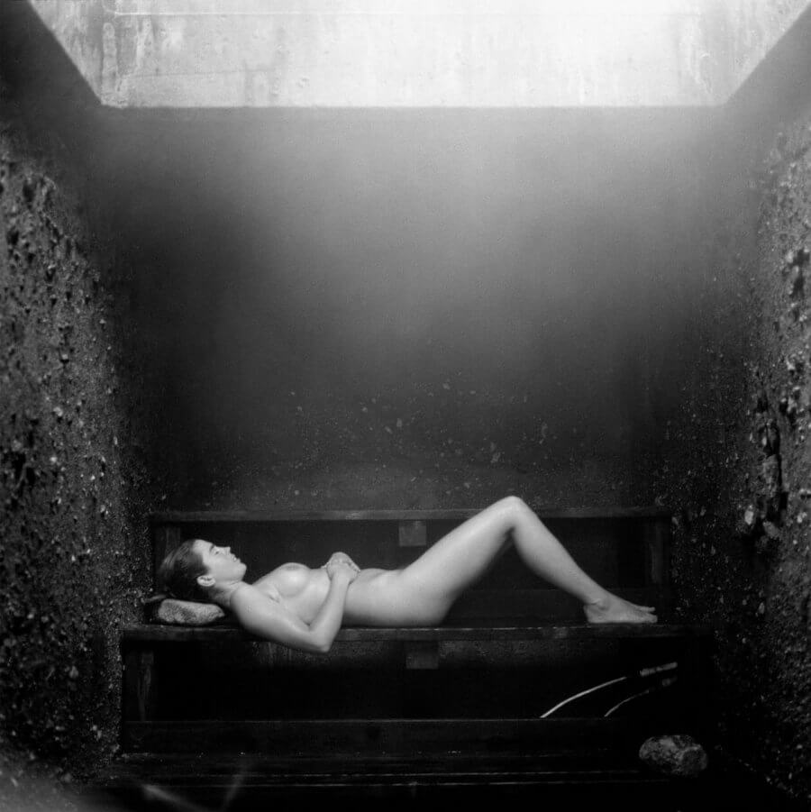Woman lying down in steam room