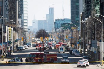 First responders close down Yonge Street in Toronto after a van mounted a sidewalk, crashing into a number of pedestrians on April 23, 2018