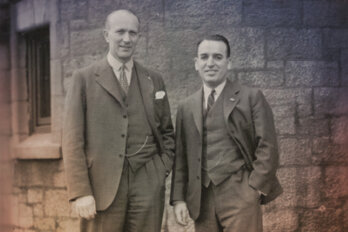 A photograph of Dr. Wilder Penfield and Dr. William Cone standing outside Royal Victoria Hospital in Montreal