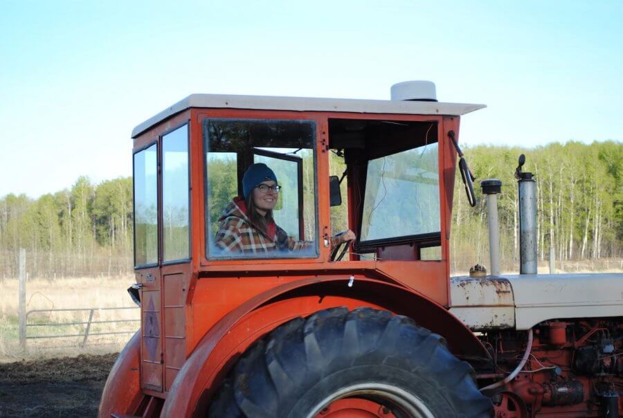 Woman Driving a Tractor