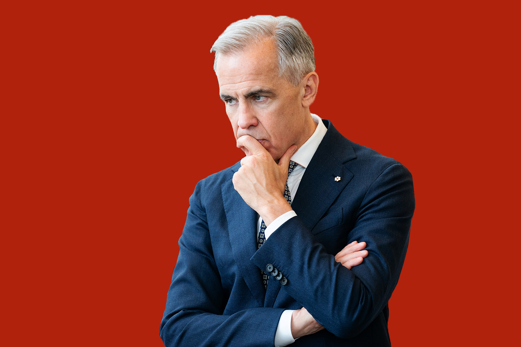 Photo of Prime Minister Mark Carney making a thinking face with his hand pressed to his chin and mouth on a red background.