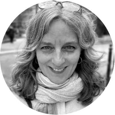 A black and white headshot of Dafna.