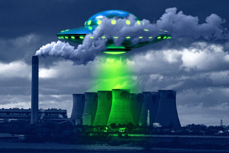 Image of an alien flying saucer hovering over a nuclear power plant and projecting a green beam of light on the building.