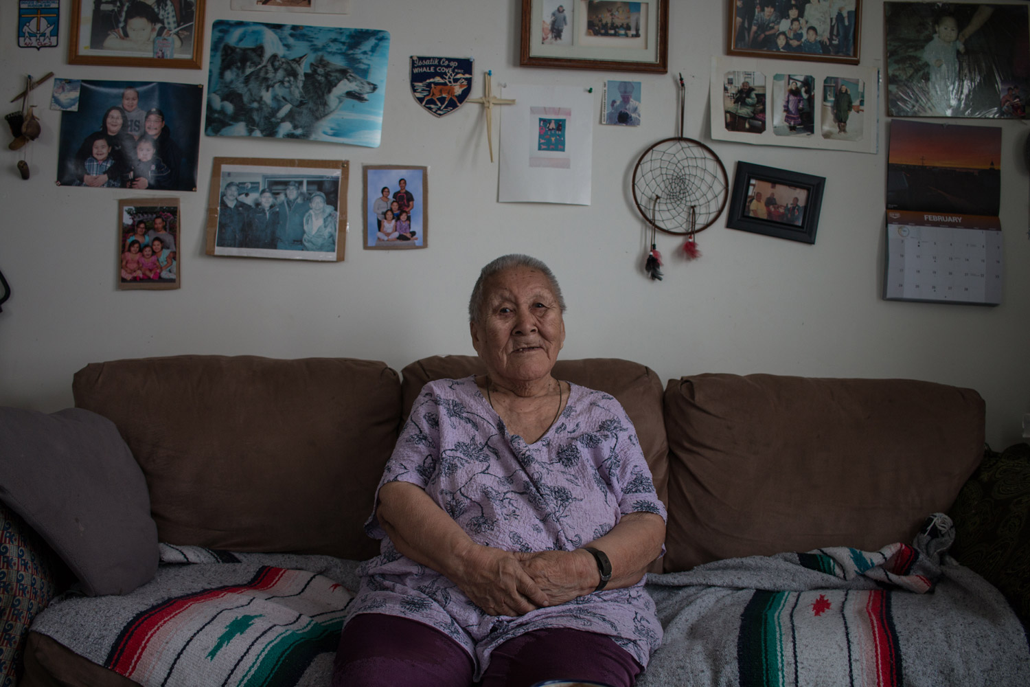 A woman sits on a couch