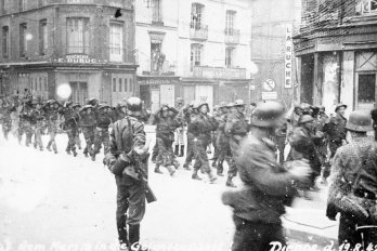 Captured Canadian troops are marched through the streets of Dieppe, following Operation Jubilee