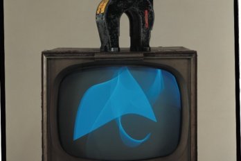 TV with a translucent blue graphic floating on the screen