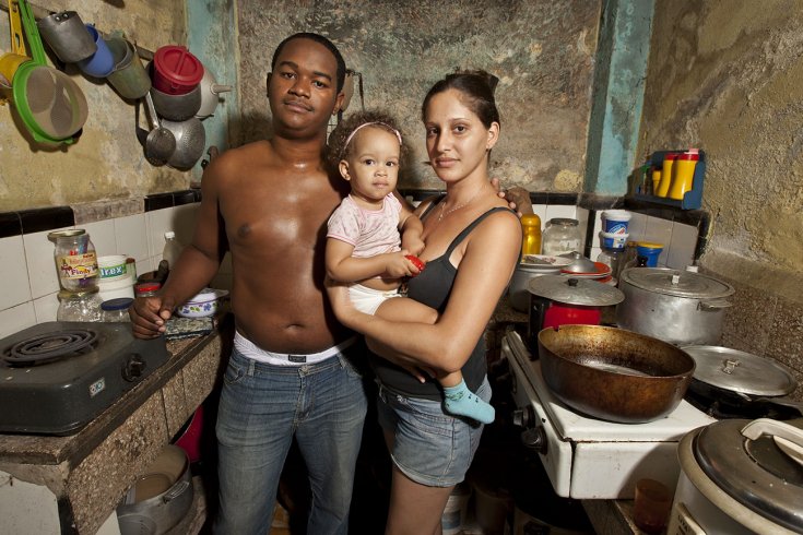 Cuban family posing in house
