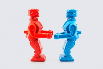 blue and red toy robots facing each other