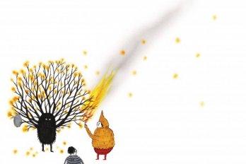 man lighting anthropomorphic figure with tree branches for hands