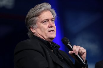 Photo of Steve Bannon holding a microphone.